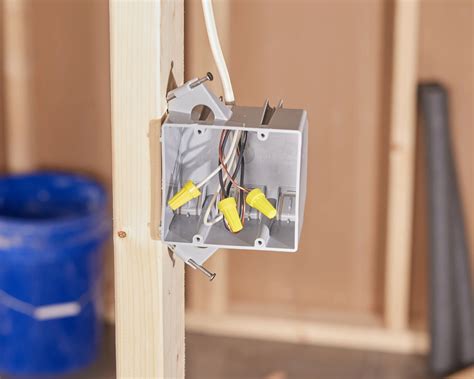 electrical boxes are usually fastened to studs with|how to attach electrical box to stud.